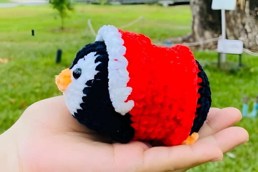 Amigurumi crochet patterns featuring a penguin ornament in a Santa outfit.
