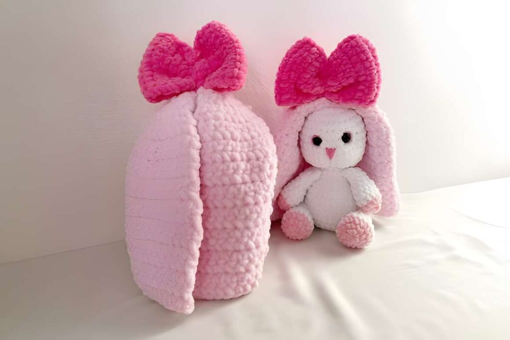 Cute Bunny Crochet Pattern featuring a pink bunny with a large bow, ideal for amigurumi crochet patterns.