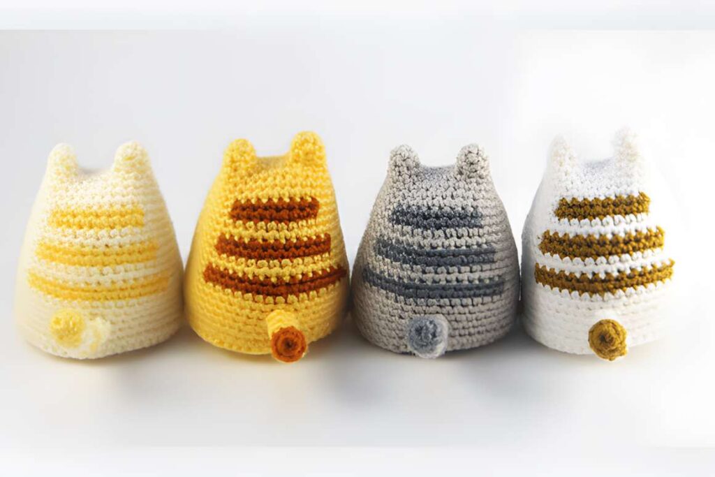 Cute Cat Amigurumi Crochet Patterns featuring four colorful hats.