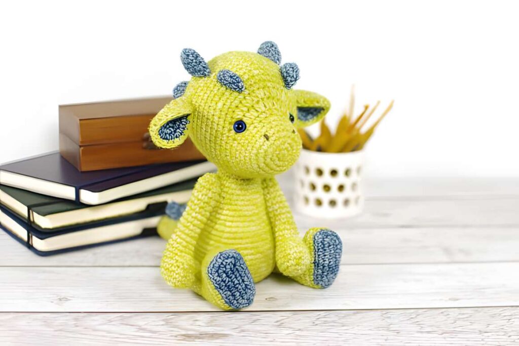 Amigurumi crochet patterns featuring a green dragon plush toy.