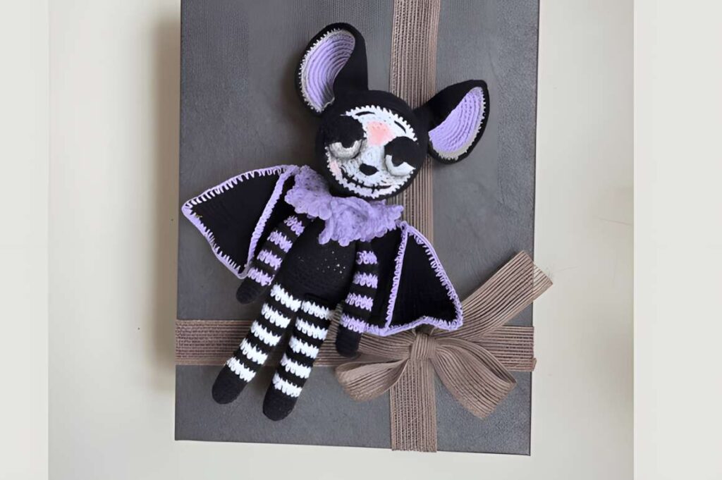 Amigurumi Halloween bat crochet pattern featuring black and purple colors. — amigurumi crochet patterns