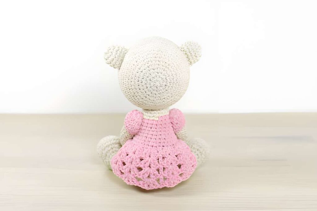 Amigurumi crochet patterns featuring a teddy bear character in a pink dress.